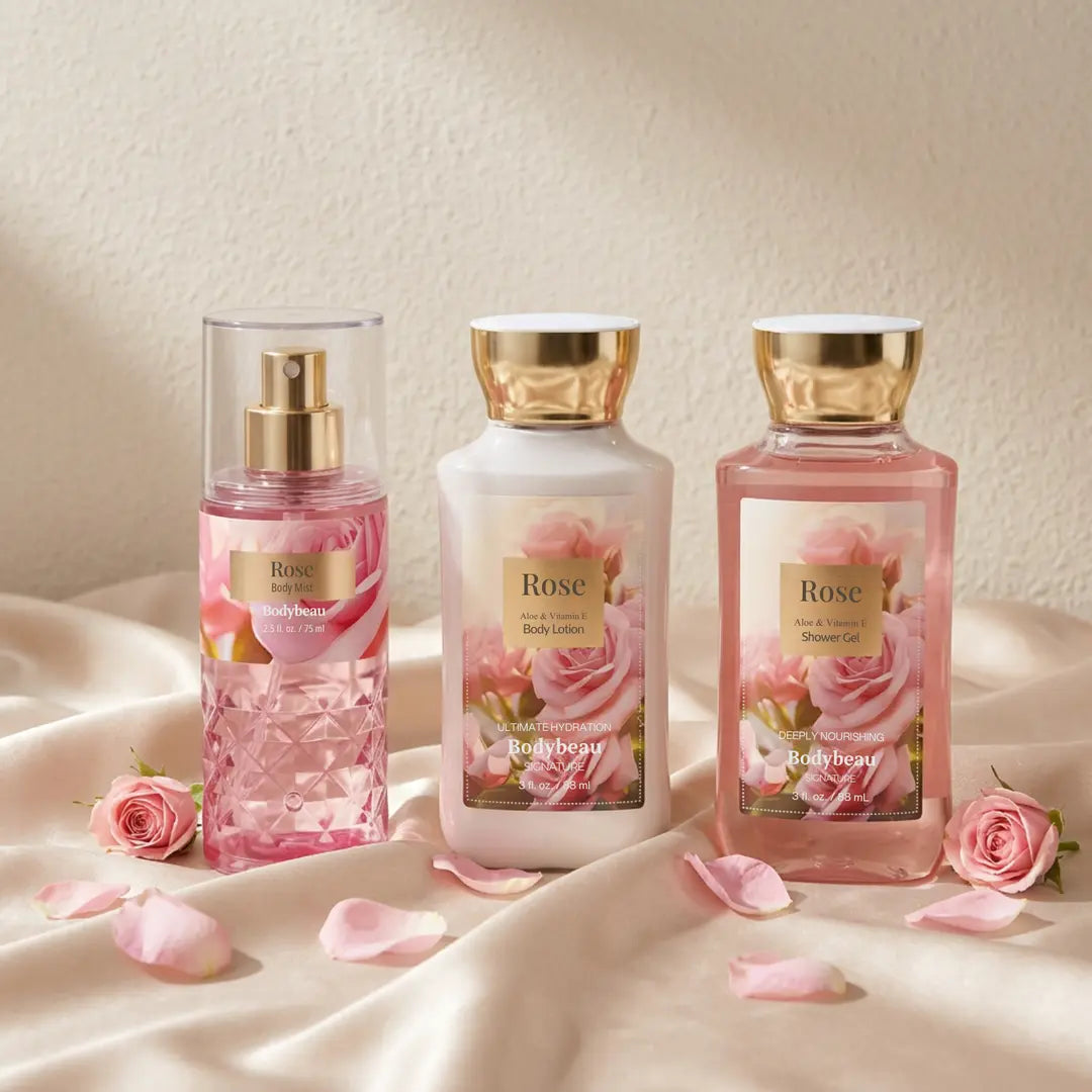 Rose body mist, body lotion, and shower gel arranged on satin with pink roses and petals