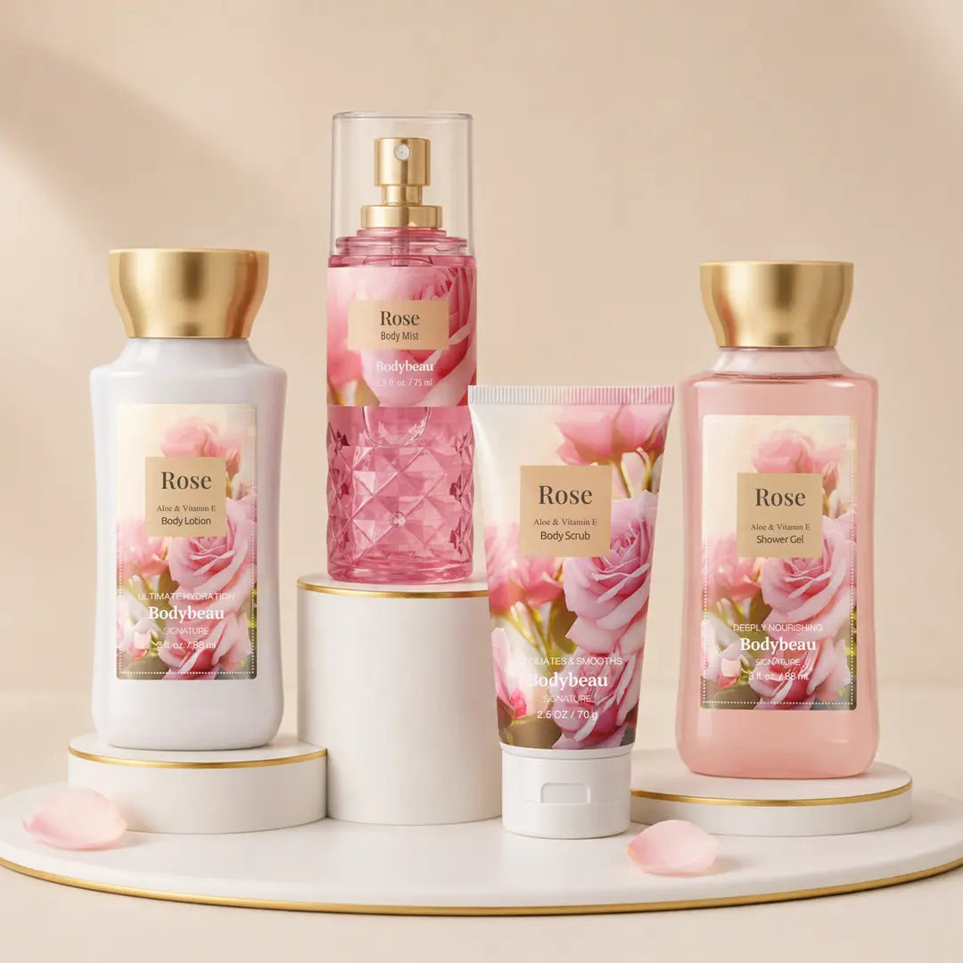 Rose four-piece bath set with body scrub, shower gel, body lotion, and body mist on a beige display